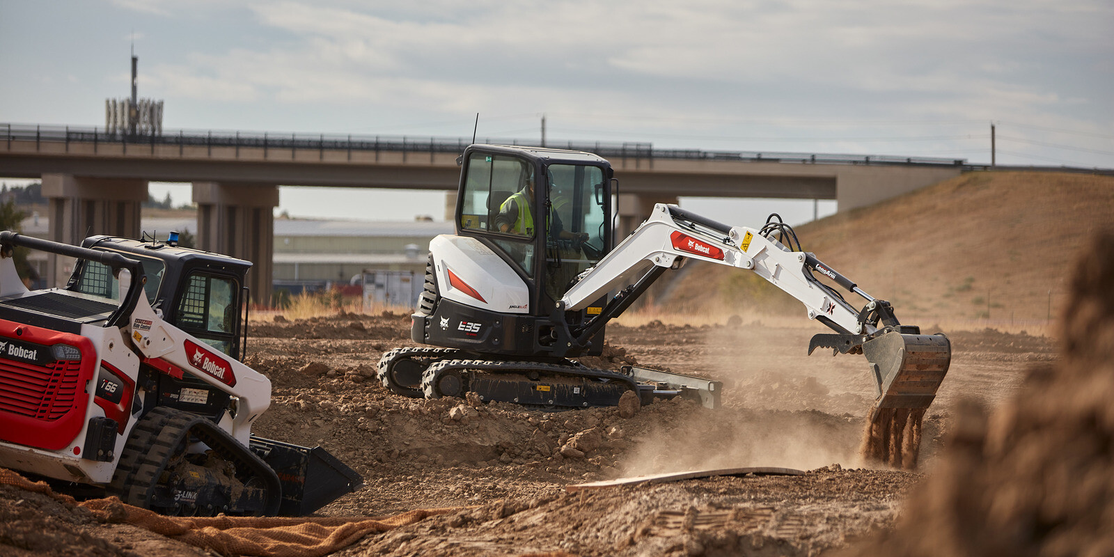 Compact skid steer loader on job site